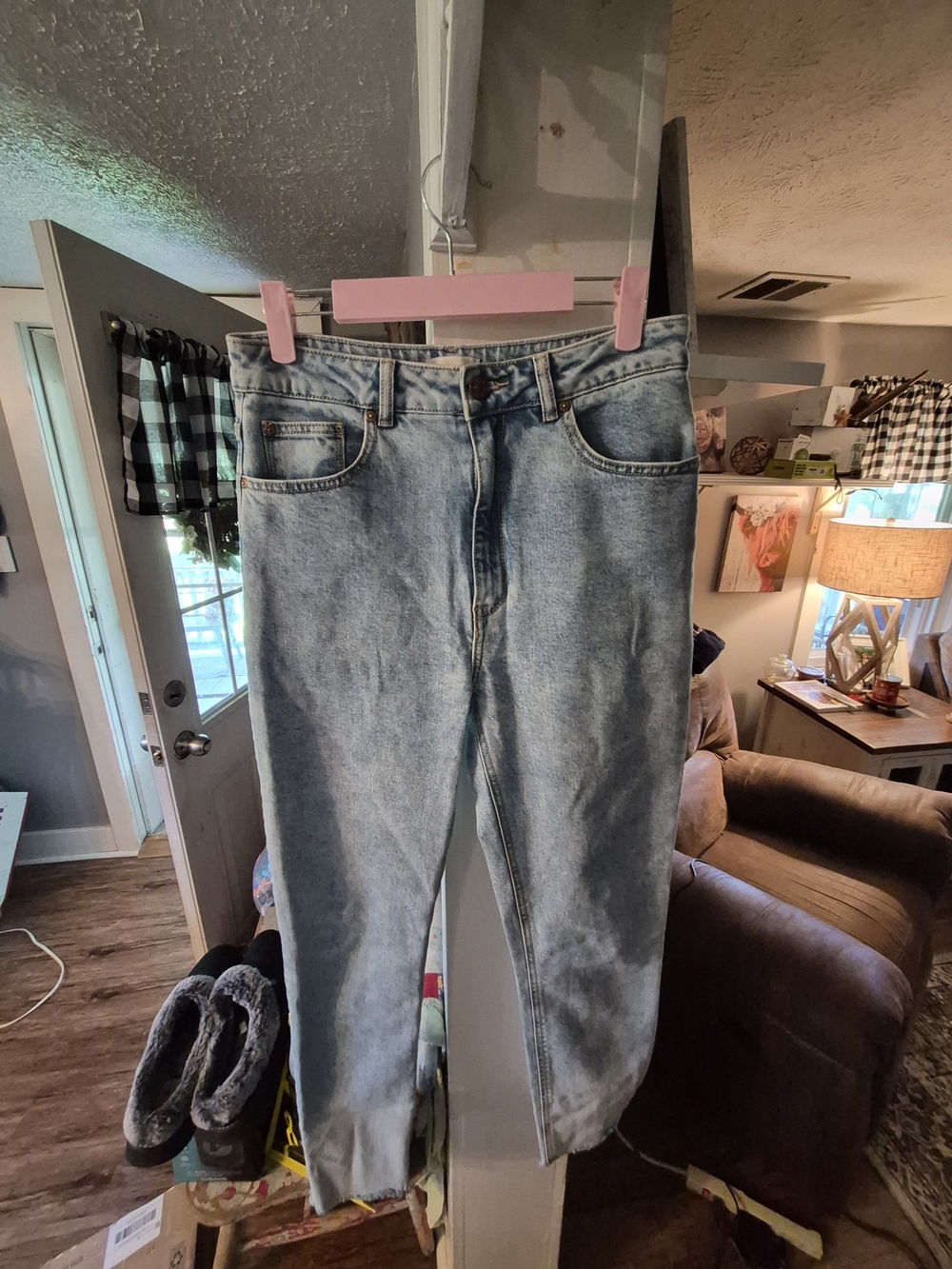 Naf Naf light-wash, high-waisted jeans feature a distinctive acid-wash texture
